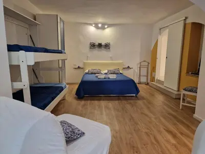 Letto o letti in una camera di Donna Mariella