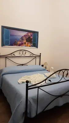 Letto o letti in una camera di Le Perle di Napoli