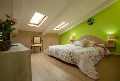 Letto o letti in una camera di La Mansarda Verde