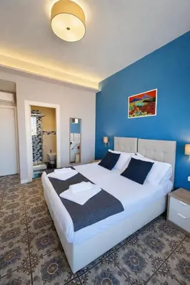 Letto o letti in una camera di La Casa di Giorgio Panoramic Rooms