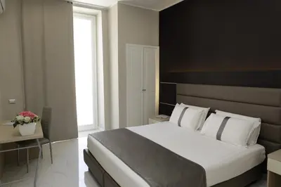 Letto o letti in una camera di Hotel Vergilius Billia