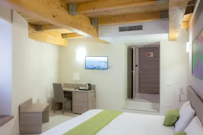 Letto o letti in una camera di Art Suite nel Cuore di Napoli