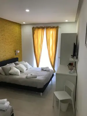 Letto o letti in una camera di Terrazza Aragon Room and SPA