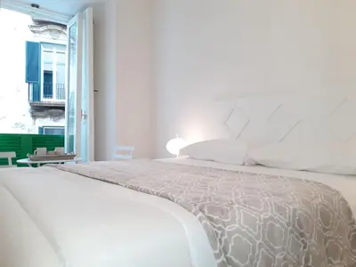 Letto o letti in una camera di Anna Home in Chiaia Unica sede