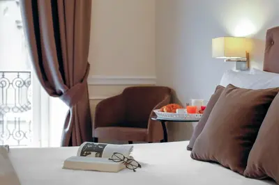 Letto o letti in una camera di La Fontanina Suites