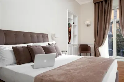 Letto o letti in una camera di La Fontanina Suites