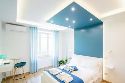 Letto o letti in una camera di Vacuna Pleasant Rooms