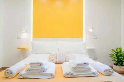 Letto o letti in una camera di Vacuna Pleasant Rooms