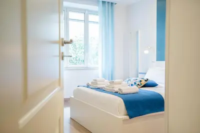 Letto o letti in una camera di Vacuna Pleasant Rooms