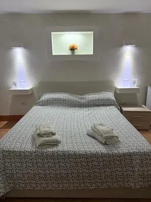 Letto o letti in una camera di Ciro E Lucia