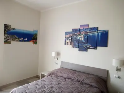Letto o letti in una camera di B&B LA DIMORA DEL CONTE