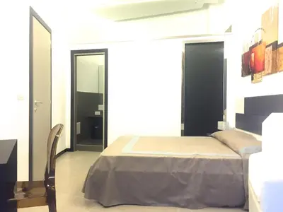 Letto o letti in una camera di Residenza Santa Lù B&B