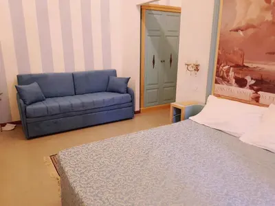 Letto o letti in una camera di La Bella Napoli B&B