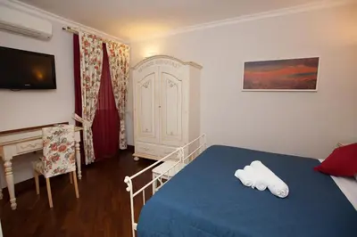Letto o letti in una camera di affittacamere ausonia