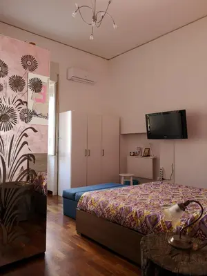 Letto o letti in una camera di B&B Smiling Naples
