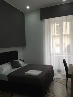 Letto o letti in una camera di MB95 - Mezzocannone Luxurious Bed&Breakfast