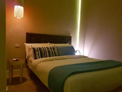 Letto o letti in una camera di B&B NAPOLI AMORE MIO