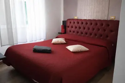 Letto o letti in una camera di BHome Fashion Suite