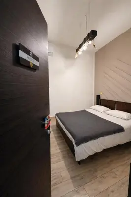 Letto o letti in una camera di BHome Fashion Suite