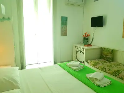 Letto o letti in una camera di B&B Platamon
