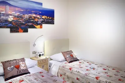 Letto o letti in una camera di Home sweet home Cathedral