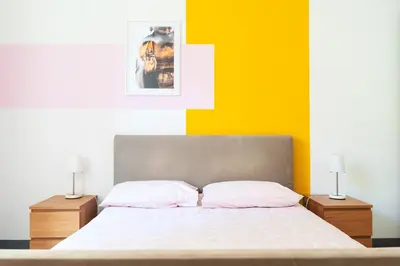 Letto o letti in una camera di Casa Conforti luminosa in centro