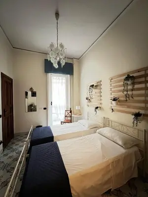 Letto o letti in una camera di Maman Suite, city center near Molo Beverello