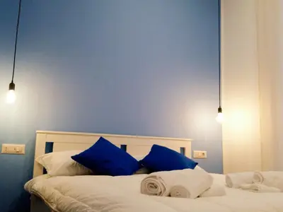 Letto o letti in una camera di B&B Monserrato