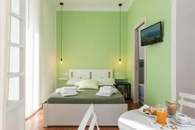 Letto o letti in una camera di B&B Monserrato