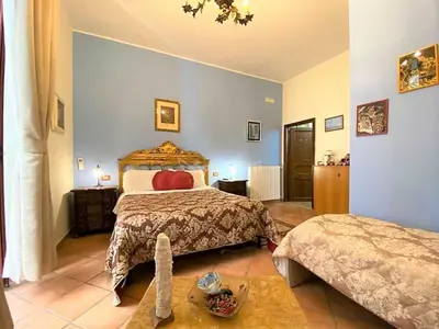 Letto o letti in una camera di B&B Donna Anna