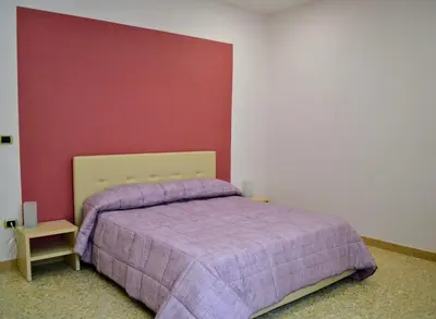 Letto o letti in una camera di Le Sirene