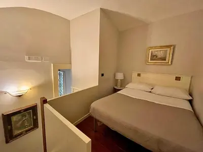 Letto o letti in una camera di B&B Palazzo Solimena