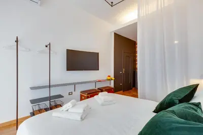 Letto o letti in una camera di ALMA de Toledo Design Home Plebiscito
