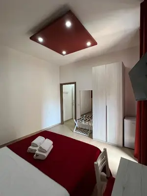 Letto o letti in una camera di Napoli Central Gate