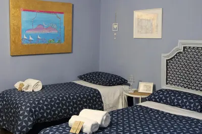 Letto o letti in una camera di Casa Avallone