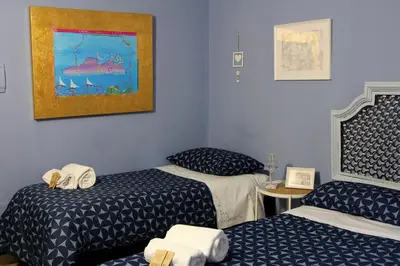 Letto o letti in una camera di Casa Avallone
