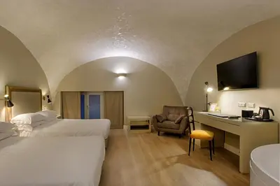 Letto o letti in una camera di Caruso Place Luxury Rooms & Suites