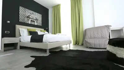 Letto o letti in una camera di Ecumano Space
