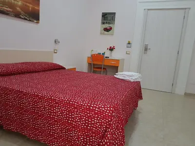 Letto o letti in una camera di Napul'è
