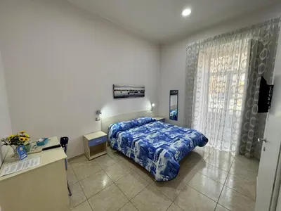 Letto o letti in una camera di Napul'è