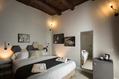 Letto o letti in una camera di Naplesuite