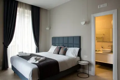 Letto o letti in una camera di Naplesuite
