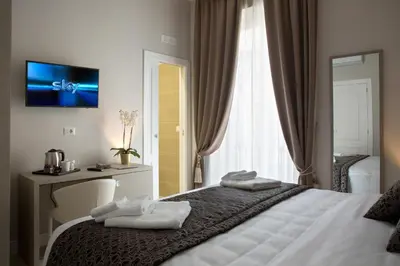 Letto o letti in una camera di Naplesuite