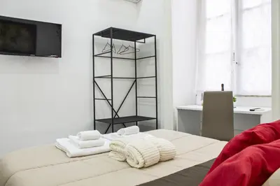 Letto o letti in una camera di Amare Napoli
