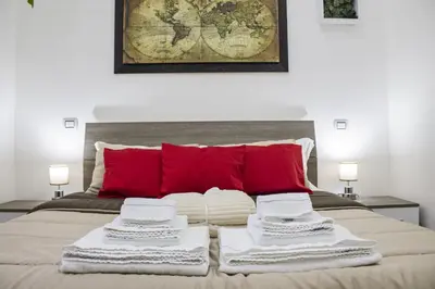 Letto o letti in una camera di Amare Napoli