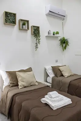 Letto o letti in una camera di Amare Napoli