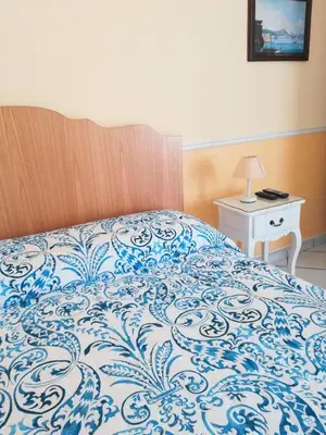 Letto o letti in una camera di Santa Lucia 50