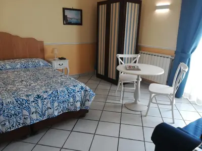Letto o letti in una camera di Santa Lucia 50