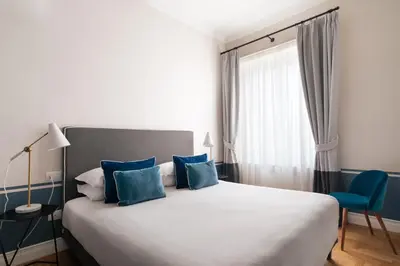 Letto o letti in una camera di Caracciolo 13 Rooftop & Suites