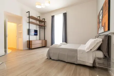 Letto o letti in una camera di Palazzo Della Porta
